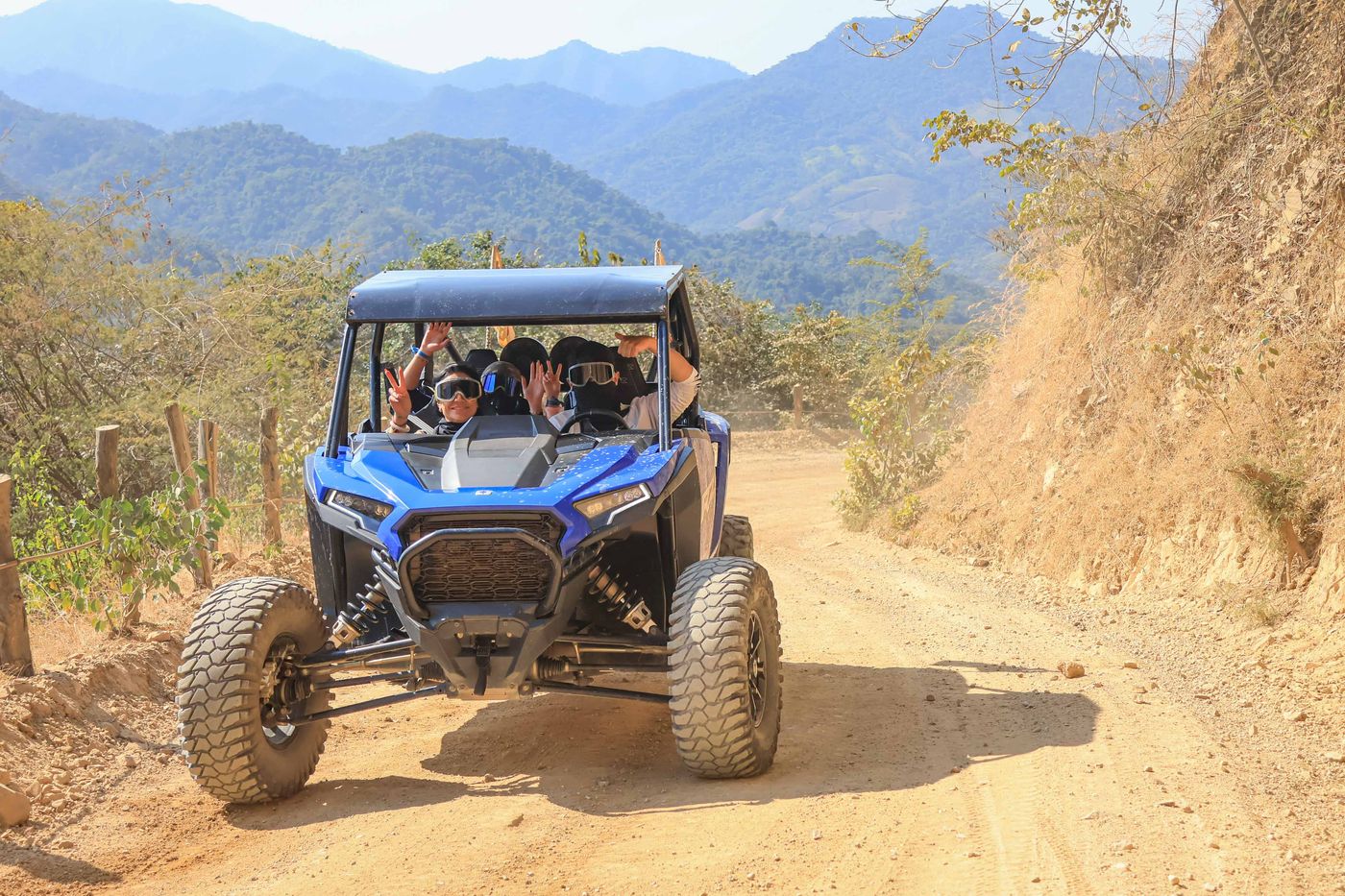 Polaris RZR driving dusty dirt roads during the adventure tour.