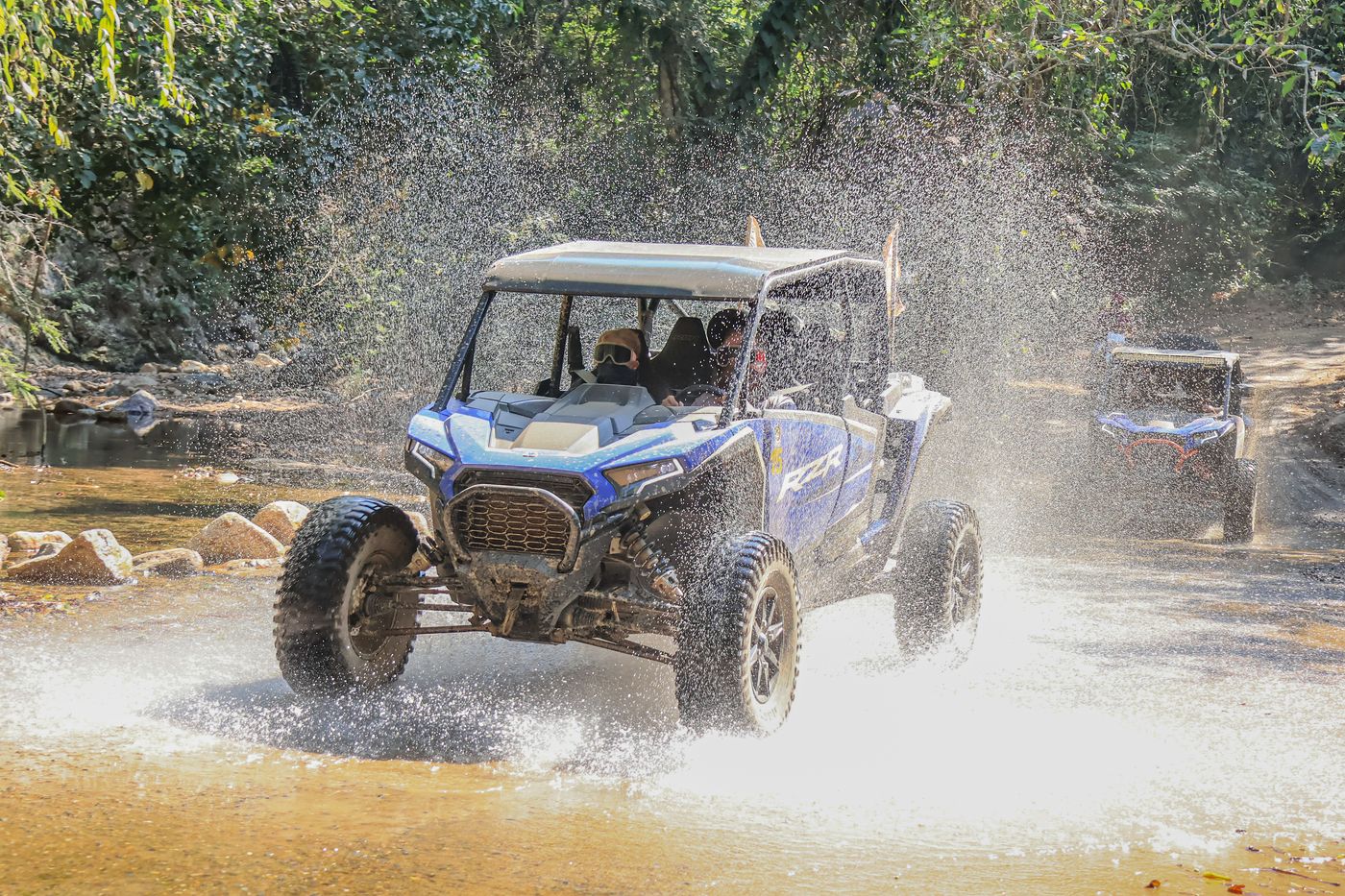 Polaris RZR crossing a river during an adventure tour in Puerto Vallarta.