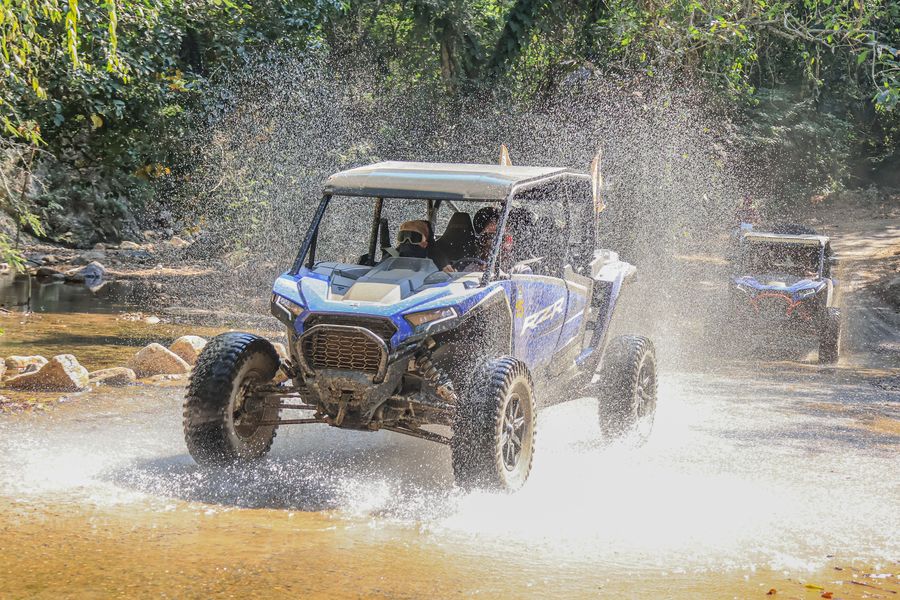 Polaris RZR crossing a river during an adventure tour in Puerto Vallarta.