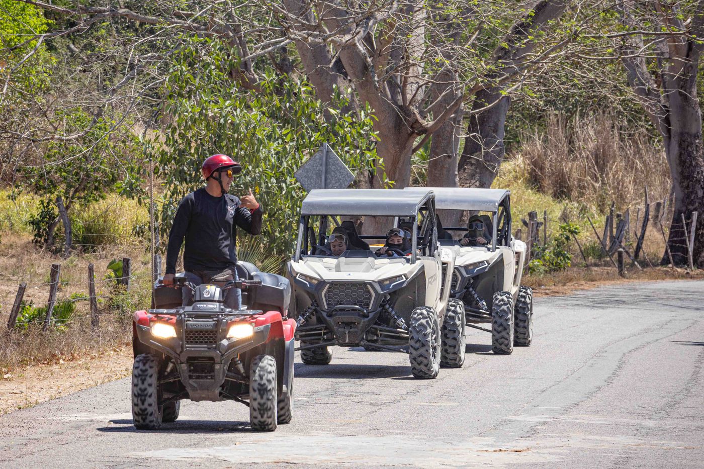 Guide leading a group of RZRs on an adventure tour in Nayarit