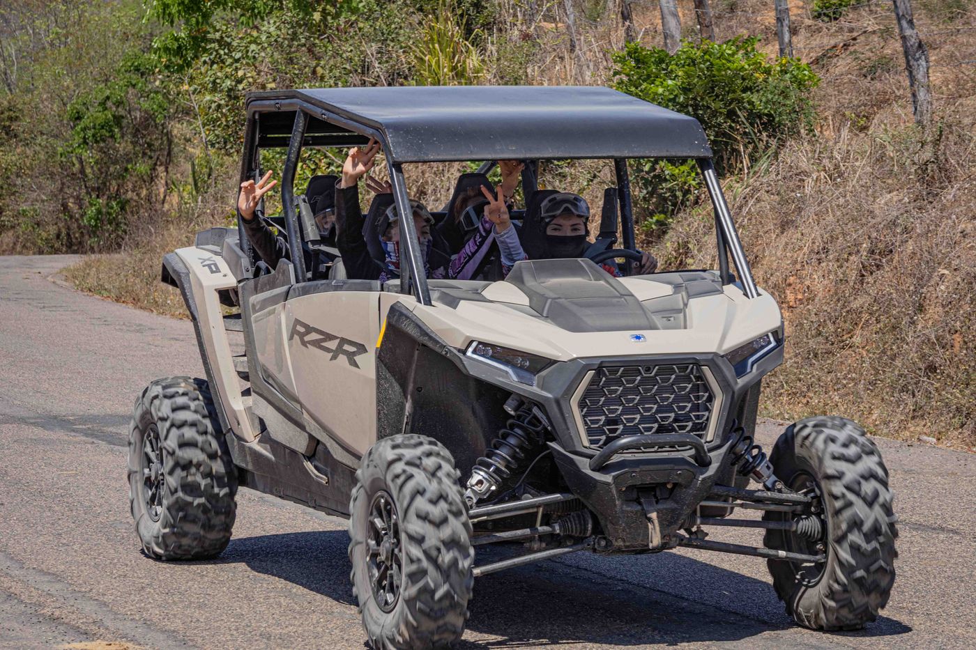 Family enjoying a four-passenger RZR tour in Nayarit