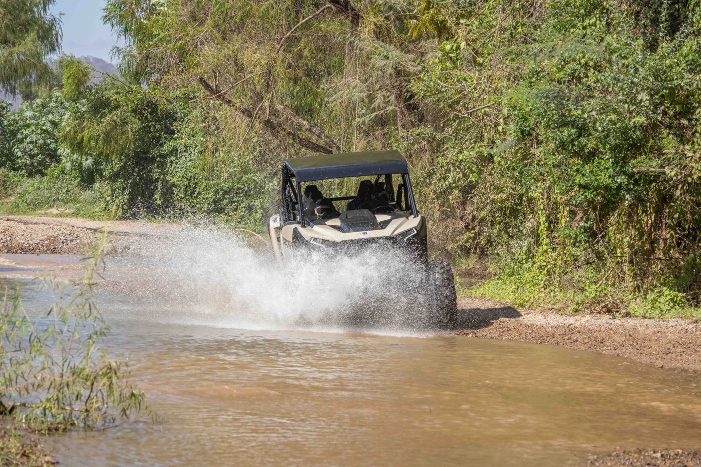 RZR crossing a river during an off-road tour in Nayarit