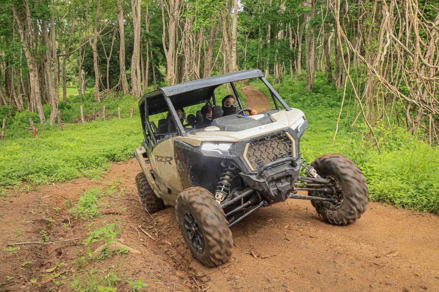 RZR driving along a private trail through the green forests of Nayarit