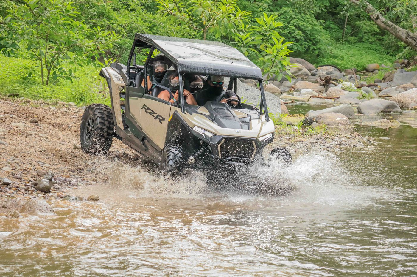 RZR driving through a water crossing on an off-road route in Nayarit