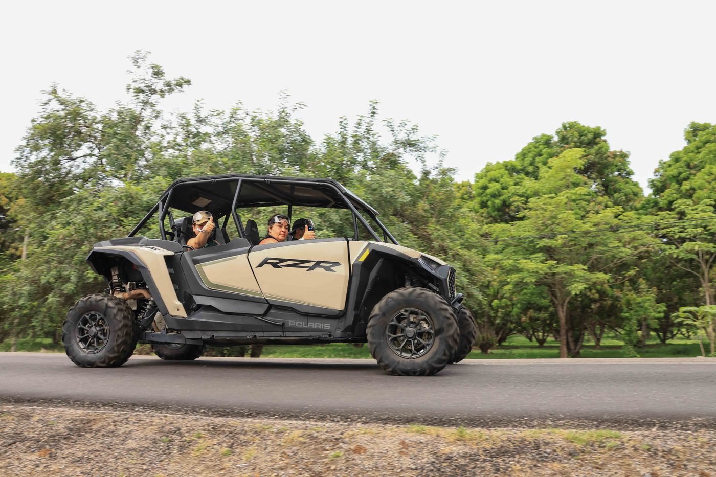 Family riding a Polaris RZR during an adventure in Nayarit