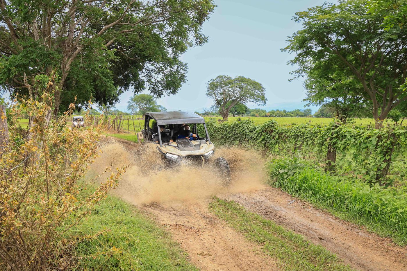 RZR driving through water on an off-road Capomo Route tour in Nayarit