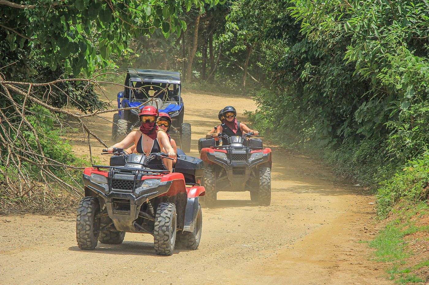 Couples riding double ATVs during an off-road adventure in Puerto Vallarta
