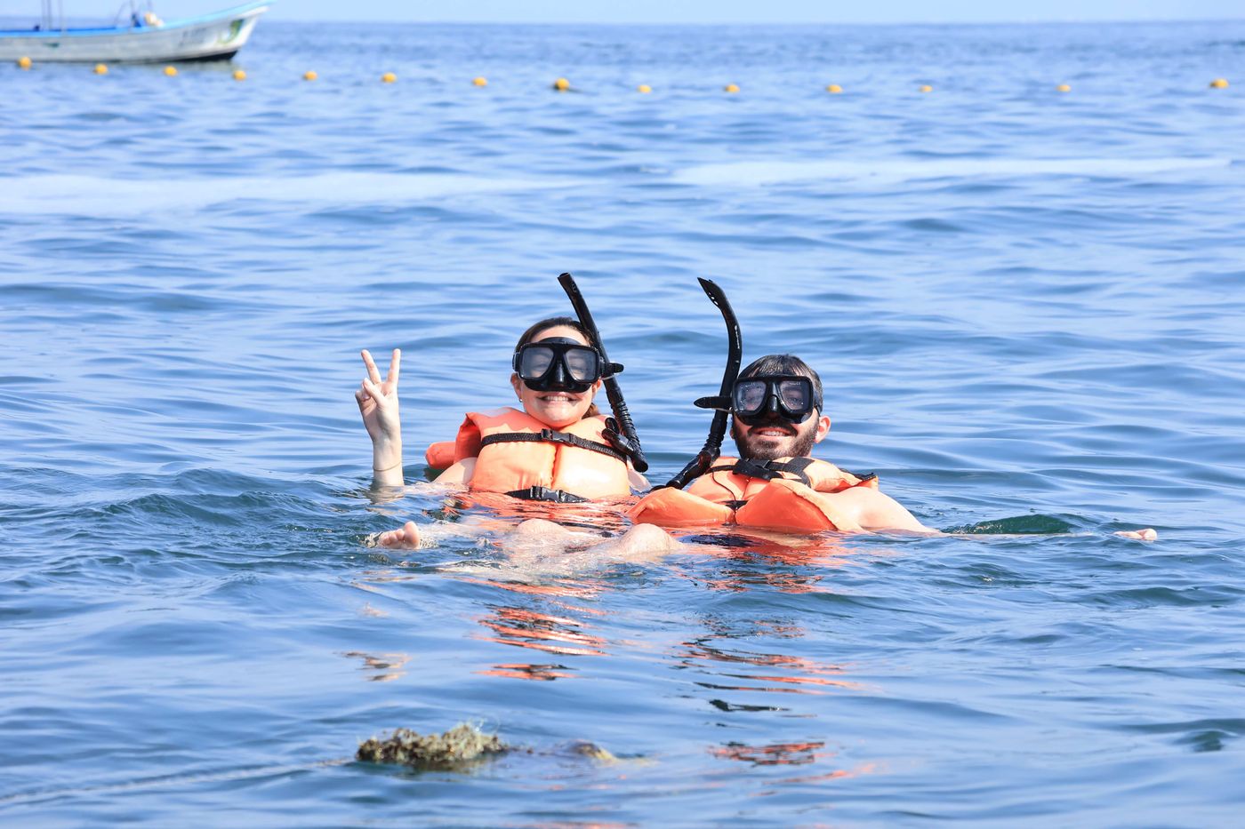 Travelers discovering marine life during a snorkeling excursion
