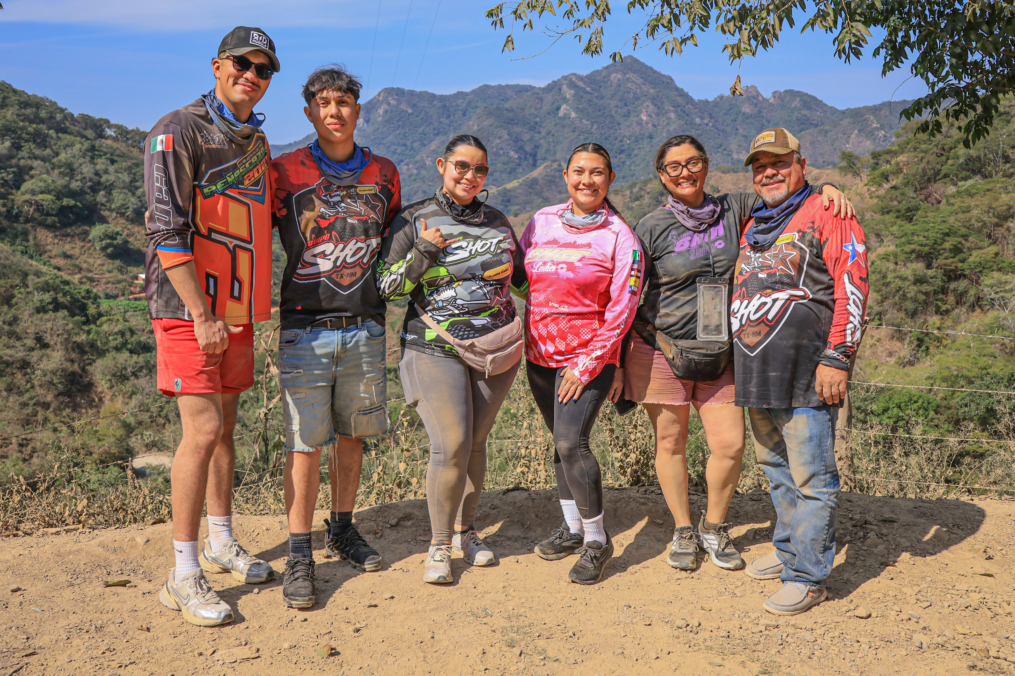 Adventure group enjoying a scenic mountain viewpoint during a tour in Puerto Vallarta.